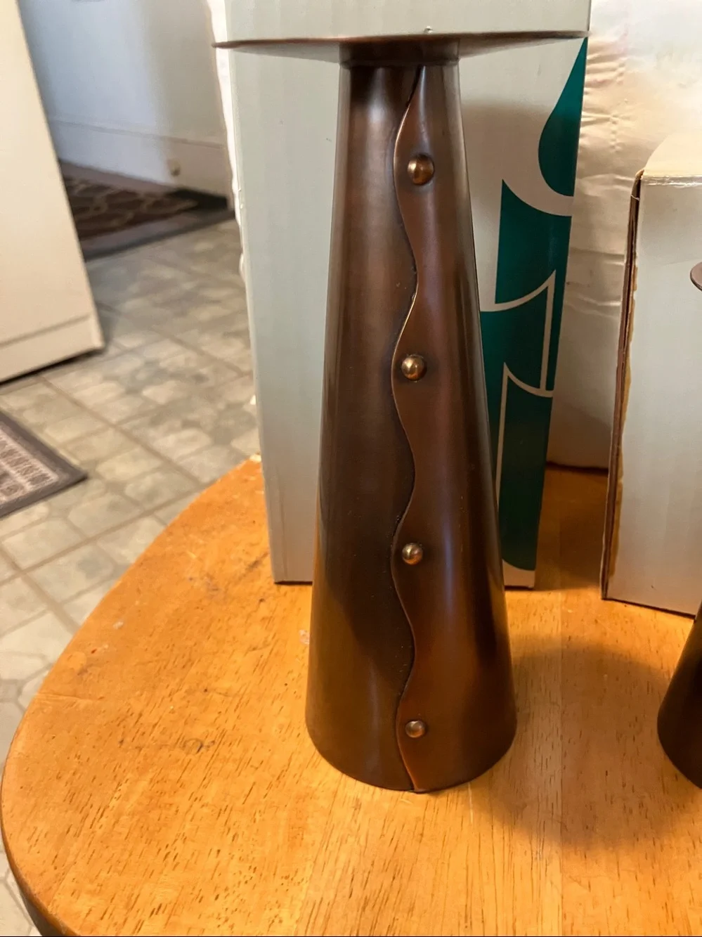 New.  Set of 2. Partylite copper stands for pillar candles with swirl design